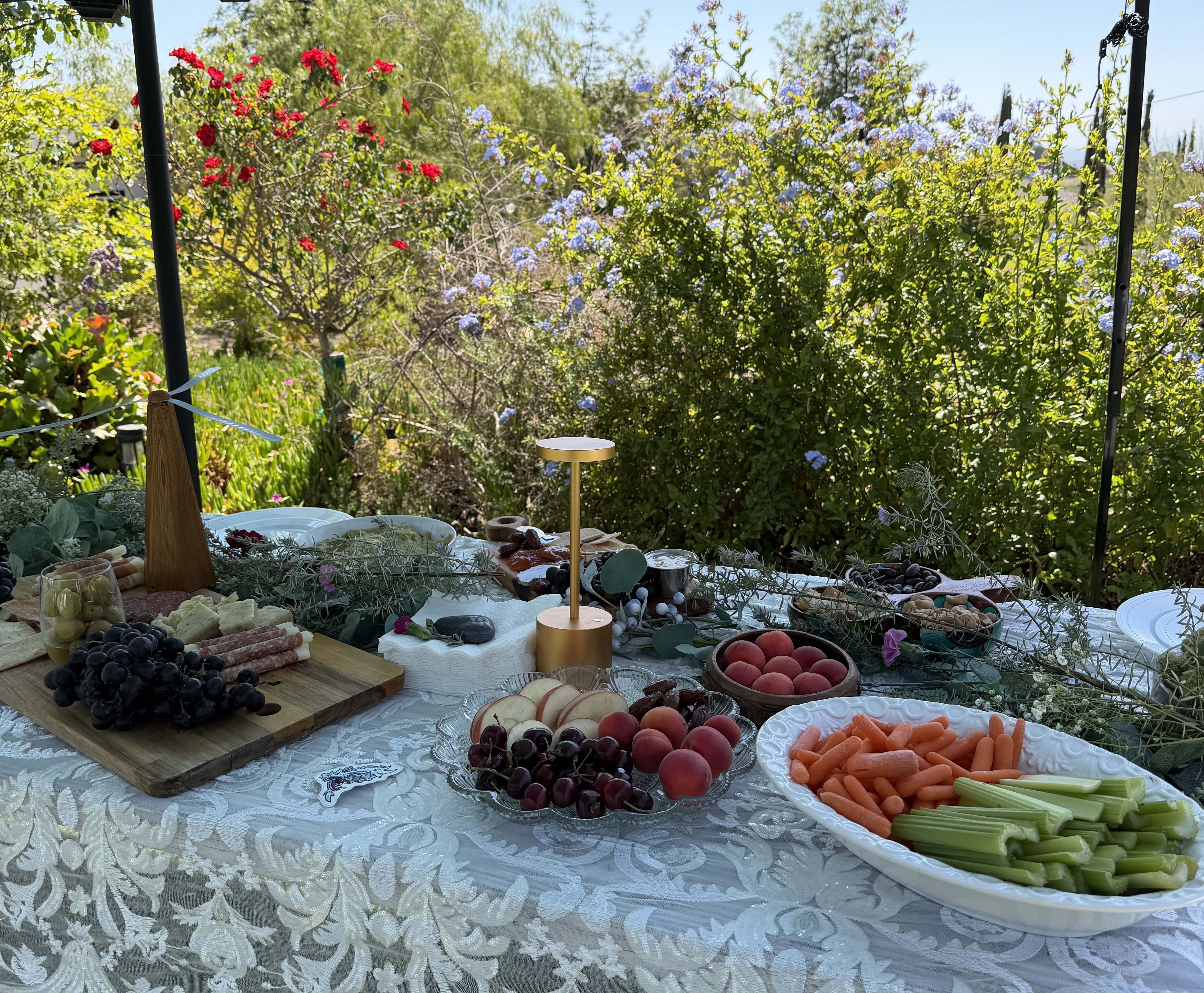 Grazing table with seasonal produce and flowers