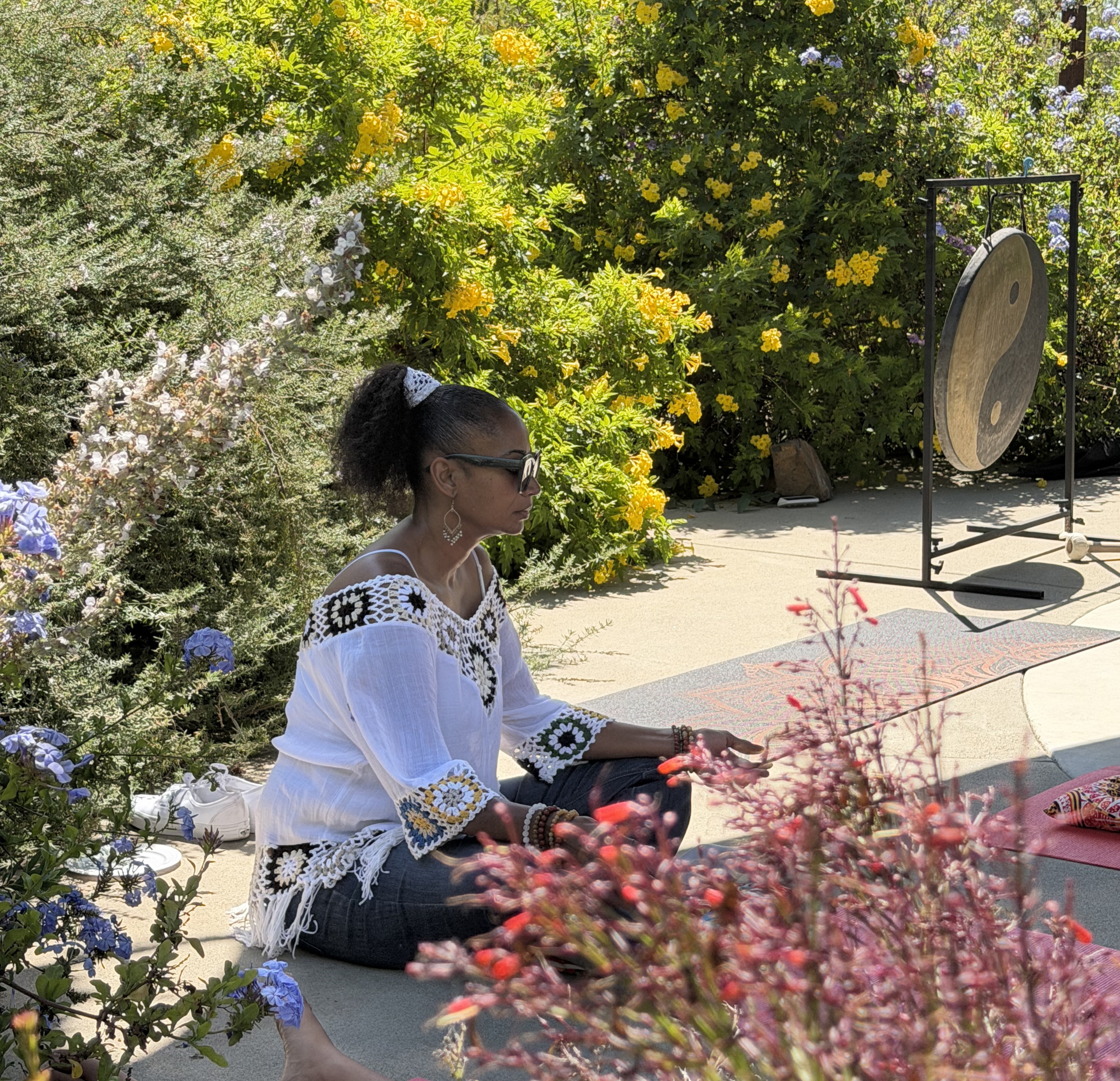 Guest in meditation by the gong