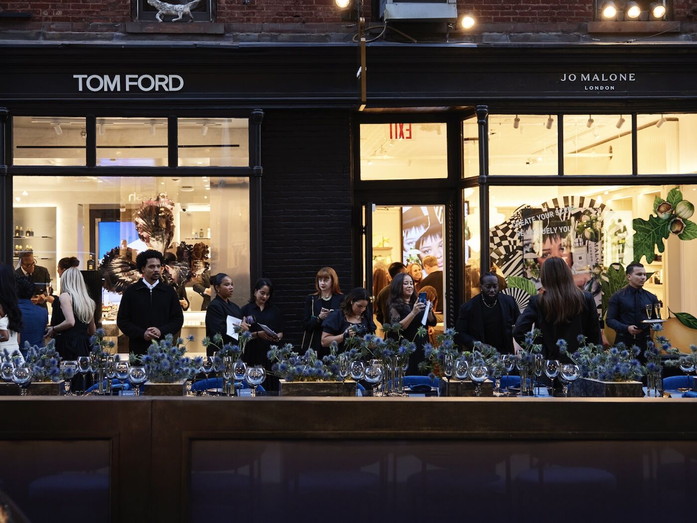 Tom Ford and Jo Malone storefronts with guests before dinner