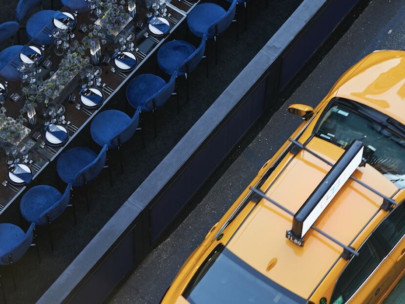 Overhead view of the table with passing taxi